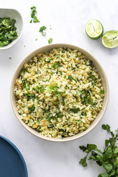 This cilantro lime cauliflower rice recipe comes together in under 15 minutes and has a ton of flavor! It’s the perfect low carb side dish and makes a great base for a burrito bowl or taco salad. Lime Cauliflower Rice, Cilantro Lime Cauliflower Rice, Low Carb Side, Macro Recipes, Eating Bird Food, Frozen Cauliflower Rice, Cauliflower Rice Recipes, Cilantro Lime Rice, Low Carb Side Dishes