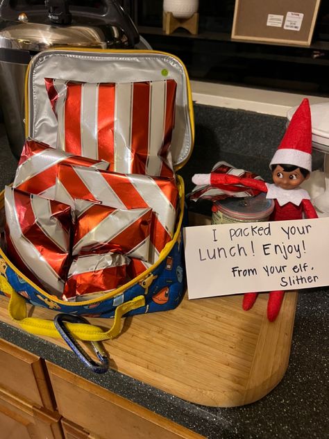 Elf packed lunch and wrapped with wrapping paper!! Elf Wrapped In Wrapping Paper, Elf On The Shelf Wrapping Presents, Elf Wrapping Ideas, Elf Wrapping Paper Ideas, Elf On The Shelf Wrapping Paper, Lunch Wraps, Elf Activities, Paper Lunch, Packed Lunch