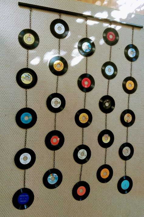 "A new series of mixed-media wall hangings/beaded curtains, made out of real 7\" records.  Hung with stainless steel jack chain on 1\" wooden dowel, for a total length of 6 feet and width of 5 feet. I can also adjust or add to the current length. Makes an excellent addition to bedroom, art studio, living rooms, any kind of music or creative spaces. To hang, you simply need to install some kind of ceiling hook and/or fishing line to adjust the height. Records are fragile, so make sure to take out Bedroom Art Studio, Record Diy, Vinyl Records Diy, Vinyl Record Decor, Record Decorations, Vinyl Record Wall Art, Vinyl Record Crafts, Cd Wall, Record Crafts