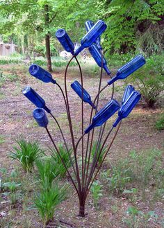 Wine Bottle Trees, Garden Improvement, Bottle Trees, Bottle Tree, Blue Bottle, Glass Garden, Colorful Garden, Garden Crafts, Lawn And Garden