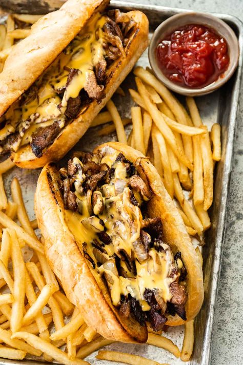 Philly Cheesesteak made in your own kitchen with tender rib eye steak, caramelized onions, and Cheese Whiz, in a buttery hoagie roll. Philly Cheesesteak Recipe, Philly Cheese Steak Sandwich, Philly Cheese Steak Recipe, Cheese Whiz, Philly Steak, Steak And Onions, Cheesesteak Recipe, Dinner Then Dessert, Cheese Steak Sandwich