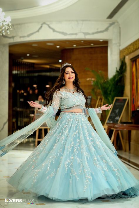 Powder blue lehenga with minimal jewellery and a sparkling tiara.  For more such beautiful outfit, Book your wedding Designers on ShaadiSaga.com   | Shaadisaga | Bridal Lehenga | Bridal Makeup | Mehendi | Bridal Jewellery | Tiara | Chooda | Bridal Portrait | Royal Look Blue Lehenga Jewellery Ideas, Lehenga Jewellery Ideas, Minimalistic Bride, Sky Blue Lehenga, Mehendi Bridal, Wedding Designers, Lehenga Bridal, Lehenga Jewellery, Latest Bridal Lehenga