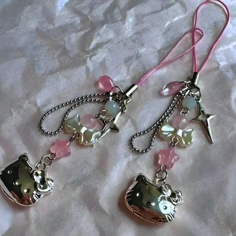 hello kitty phone charm! Featuring bows, stars, and a cute hello kitty locket! price: 670/- pkr ◕ product might be different from the picture due to lighting and effects 😓😓 ◕ ww shipping available ◕ for international shipping, see "ww shipping" highlight for shipping in Pakistan, see "pk shipping" highlight ◕ pls read shop policy before ordering follow @arzuubeadshop for more! pls ignore 👇 Keywords: [handmade, hello kitty, y2k, coquette, phone charm, sanrio, kawaii, pastel, cute a... Sanrio Phone Charm, Hello Kitty Phone Charm, Sanrio Phone, Hello Kitty Phone, Hello Kitty Y2k, Cute Hello Kitty, Y2k Coquette, Phone Charm, Locket