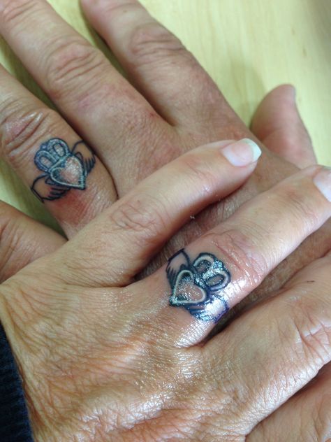 The Claddagh ring (Irish: fáinne Chladaigh) is a traditional Irish ring given which represents love, loyalty, and friendship (the hands represent friendship, the heart represents love, and the crown represents loyalty).  "With these hands I give you my heart and crown it with my love".  Peter & Tammy.  Tattoo done by John @ The Brass Monkey, Port Richey, FL Heart Ring Tattoo, Claddagh Ring Tattoo, Wedding Ring Finger Tattoos, Claddagh Tattoo, Ring Tattoo Designs, Wedding Band Tattoo, Tato Tradisional, Tattoo Band, Ring Tattoo