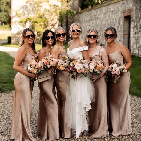 Butley Priory & Black Tie weddings - a match made in heaven! Here's Barrie and Grace leading the way with their groomsmen and bridesmaids, dressed in a delectable black tie and cappuccino gold dresses. A very elegant colour palette, perfect for the September sunshine and the florals were simply divine... Photos: @da.studio.team Venue: @butleypriory Catering: @pharrisonchef Marquee: @eventsundercanvastipis Dress: @silkandmaplebridal Music: @gainsboroughquartet Flowers: @passionflowersb... Different Shades Of Gold Bridesmaids, Dark Gold Bridesmaid Dresses, Bridesmaid Dresses September Wedding, Mocha Bridesmaids Dresses, Butley Priory, Bronze Bridesmaid Dresses, Black Tie Bridesmaids, Beige Bridesmaid Dress, Beige Bridesmaids