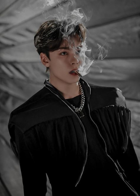 Vernon poses with a bullet in between his teeth. White smoke is in the air around him coming from the bullet Seventeen Vernon, Vernon Hansol, Choi Hansol, Vernon Chwe, Vernon Seventeen, Won Woo, Seventeen Going Seventeen, Seventeen Wallpapers, Pledis Entertainment