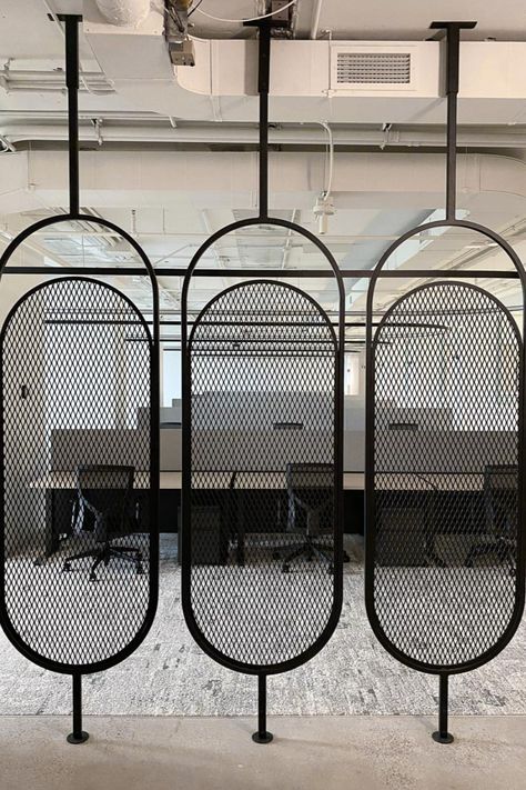 custom steel space divider in a pill shape and expanded metal infill Metal Screen Room Divider, Modern Room Divider Ideas, Office In Home, Room Divider Ideas Diy Cheap, Steel Room Divider, Room Divider Ideas Diy, Commercial Interiors Office, Metal Mesh Screen, Space Divider