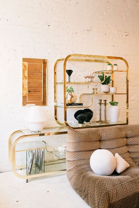 Toronto-based vintage shop The Apartment sells curated vintage in store, online and on Instagram. Photo: The Apartment/Janet Kwan Brass And Glass Shelves, Brass Etagere, Brass Shelving, Vintage Trends, Milo Baughman, Leather Couch, Book Storage, Album Book, Vintage Models