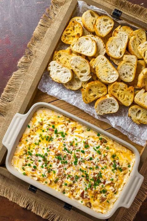 Boudin Dip! This Louisiana-inspired Boudin dip is baked hot and bubbly with spicy Boudin Cajun sausage, a mix of cheeses, and sour cream. Perfect for parties or game day! | HomemadeHooplah.com Boudin Dip Recipe, Boudin Dip, Cajun Appetizers, Boudin Recipe, Mardi Gras Party Food, Boudain Recipes, Boudin Sausage, Cajun Sausage, Cajun Dishes