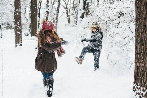 Two friends playing in the snow, throwing snowballs Playing In The Snow Couple Aesthetic, Snow Pics With Friends, Winter Snow Photography, Playing In Snow, Snow Engagement Photos, Snow Engagement, Pics With Friends, Snow Pics, Christmas Couple Pictures