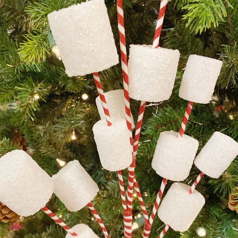 Christmas Floral Spray Make your holidays extra sweet with a Gingerbread inspired theme. This marshmallow spray will be the perfect addition. Fourteen glittery white marshmallows sit on top of peppermint wired sticks. The sticks can be spread out and twisted to really fill in your greenery. Pair with our other seasonal products for your DIY Christmas decor creations. Add to any wreath or teardrop to be used as door decor. Include in the garland that dresses your fireplace or doorframe. Easily in Peppermint Christmas Decorations, White Marshmallows, Gingerbread Christmas Decor, Peppermint Christmas, Gingerbread House Decorations, Christmas Float Ideas, Christmas Gingerbread House, Candy Christmas Decorations, Candyland Decorations