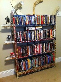 Hockey stick bookshelf Hockey Stick Furniture, Hockey Diy, Hockey Crafts, Dvd Rack, Hockey Bedroom, Hockey Room, Hockey Decor, Boys Hockey, Moms Crafts