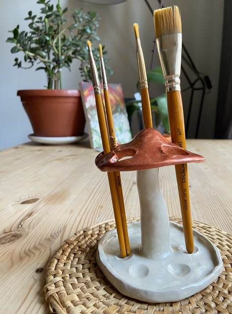 Mushroom pen and brush holder will enhance the aesthetics of any room within your home! 🍄🌱 It is made out of clay, painted and glazed. Check it out on etsy shop: KBmushROOM!💖 #mushroom #clay #gift #handmade Clay Crafts For Room Decor, Paint Brush Clay Holder, Clay Paint Holder, Clay Room Decor Aesthetic, Useable Clay Projects, Pen Holder Diy Clay, Useful Sculpture, Clay Art Pieces, Pottery Gifts Ideas