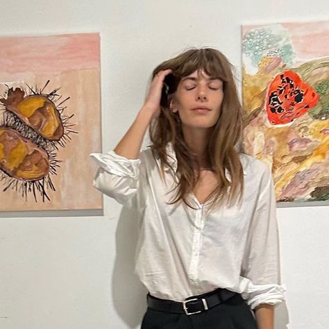 Emily Labowe on Instagram: "I was in my first group show sharing a couple of my paintings ! Show will be up for one week. Dm for inquiry. Thank you @hellomrdavid & @_sad_studios for including me— alongside some very talented female artists 💕 & to everyone who came to support. New series & pieces coming soon.. 🖤 Also thank you to @soeur_paris for my new and only pair of pants I will be wearing 🖤 #emlabowe___art" Emily Labowe Style, Emily Labowe Hair, Emily Labowe, January 2025, Blouse Style, Long Hair With Bangs, Pair Of Pants, Fall 2024, New Series