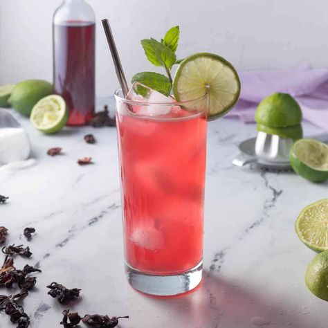 Hibiscus Limeade, Rum Drinks Recipes, Hibiscus Syrup, Limeade Recipe, Rum Punch Recipes, Dried Hibiscus Flowers, Colorful Cocktails, Light Rum, Classic Margarita