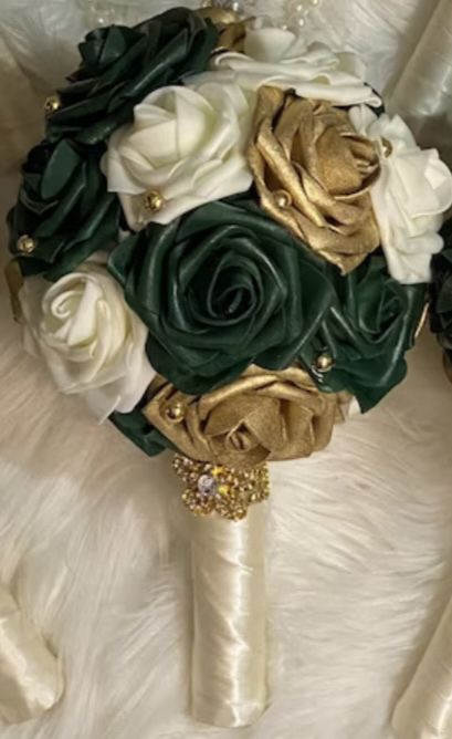 Wedding : 
	⁃	Tiara ( Matron of Honor) - gold sequin dress 
	⁃	Kaylin (Maid of Honor) - Green sequin dress 
	⁃	Heather(bridesmaid) - green satin 
	⁃	Caela (bridesmaids) - green satin
	⁃	Wendy (bridesmaids) - green satin
	⁃	Vanessa (bridesmaids) - green satin
	⁃	Ivanna (bridesmaids) - green satin
	⁃	Titi (bridesmaid) - green satin 

Maybe : 
	⁃	Iyanna (bridesmaid) - green satin ?

Colors : Hunter Green / Gold / ivory

Wedding venues : 
The 5 - Downtown 
Watersedge - Hilliard 
Creekside - Gahanna 
The Grandview Event - Downtown + Courtyard Hotel attached to venue 

￼
Brides Dress : 
￼
￼
￼

(Tiara Dress)
￼
 
￼
￼

(Kaylin Dress)
￼
￼
￼

(Titi Dress)
￼
￼
￼

(Caela Dress)
￼
￼
￼

(Heather Dress)
￼
￼
￼

(Ivana Dress) 
￼
￼
￼

(Wendy Dress) 
￼
￼
￼

(Vanessa Dress)
￼
￼
￼

Make up ideas : 
￼
￼

Hair st Emerald Green Quince Bouquet, Emerald Green And Gold Quince Ramo, Quinceanera Ramos Emerald Green, Quncie Dresses Green And Gold, Quince Flower Bouquets Green, Champagne Gold Wedding Dress, Bridesmaid Green, Bridesmaids Green, Gold Ivory Wedding