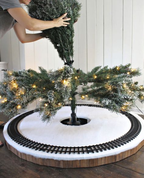 A DIY tutorial to build a Christmas tree skirt for a train. Make a safe place for the train tracks under the tree with this Christmas tree skirt. #treeskirt Build A Christmas Tree, Christmas Tree Village Display, Diy Christmas Tree Skirt, Christmas Tree Train, Christmas Tree Village, Christmas Village Houses, Christmas Village Display, A Safe Place, Christmas Train