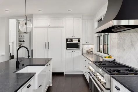 4 Winter Projects a General Contractor Can Do for You Black Marble Countertops, Cabinet Solutions, White Kitchen Cupboards, White Cabinets White Countertops, Slate Countertop, Black Kitchen Countertops, Fireclay Farmhouse Sink, Dark Countertops, Black Granite Countertops