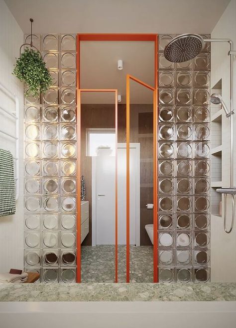 Discover this stunning bathroom designed by Framuga Studio in Poland | Featuring Alpha clear glass blocks and sleek aluminum doors with clear glass, this space creatively separates the wet and dry zones. The design balances warm wood tones, greenery, and beige hues with bold geometric shapes, incorporating squares, sage, walnut, and a striking orange frame | #bathroomdesign #boldinteriordesign #geometricstyle #glasspartition #modernbathroom #glassblock #glassbrick Modern Art Deco Bathroom, Best Bathroom Paint Colors, Bold Bathroom, Bathroom Paint, Deco Bathroom, Bathroom Paint Colors, Glass Blocks, Painting Bathroom, Art Deco Era