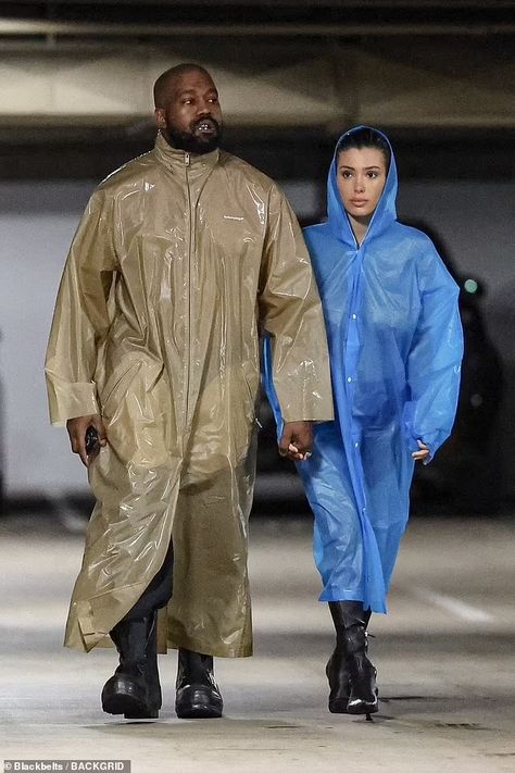 Bianca Censori struggles to protect her modesty as she goes NUDE under a clear raincoat for a studio session with mask-clad husband Kanye West | Daily Mail Online Kanye West Closet, Original Costume Ideas, Kanye West Show, Controversial Fashion, Ozzy And Sharon Osbourne, Ozzy And Sharon, Kanye West Wife, Clear Raincoat, Balenciaga Jacket