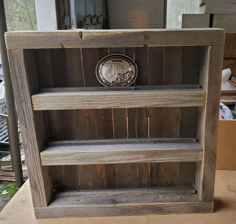 This Buckle Shelf is made from very old hand made pine barn wood. It is designed to hold 9 large buckles. Www.sorebackopi.com Belt Buckle Shelf, Belt Buckle Display, Buckle Display, Diy Belts, Sale Ideas, Boy’s Room, Shop Projects, Wood Display, Display Shelf