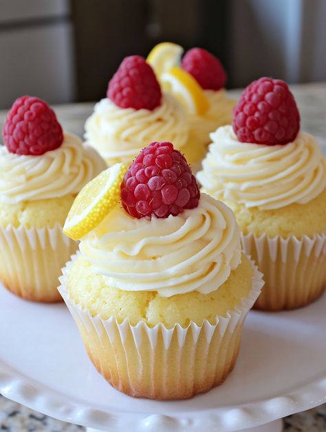 Raspberry Lemon Heaven Cupcakes     🍋 𝗜𝗻𝗴𝗿𝗲𝗱𝗶𝗲𝗻𝘁𝘀 🍋 For the Cupcakes: 1 1/2 cups all-purpose flour 1 1/2 tsp baking powder 1/4 tsp salt 1/2 cup unsalted butter, softened 1 cup granulated sugar 2 large eggs 1 tsp vanilla extract 1/2 cup milk 1 cup fresh raspberries Zest of 1 lemon For the Lemon Cream Frosting: 1/2 cup unsalted butter, softened 1/2 cup powdered sugar 2 tbsp lemon juice 1 tsp lemon zest Fresh raspberries and lemon zest for garnish Unique Baking Recipes, Lemon Heaven, Dessert Packaging, Lemon Cupcakes, Fresh Raspberries, Pretty Dessert, Tasty Baking, Cream Frosting, Coffee Dessert