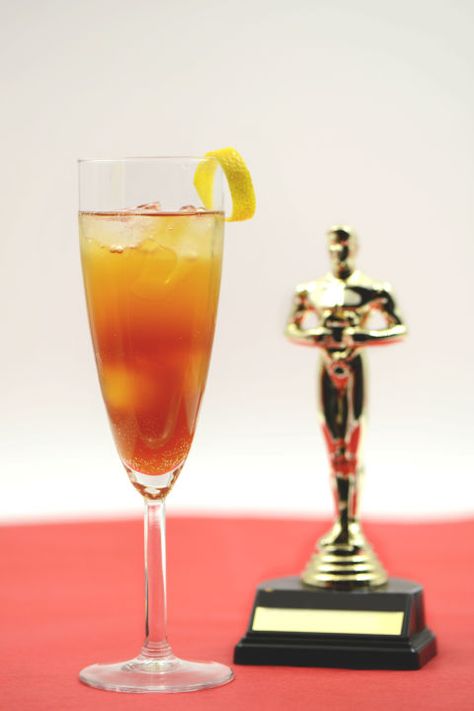 Cocktail Recipes for Your Oscar Party - Drink Recipes for The Academy Awards - Old Hollywood - Your party-goers will be impressed with the complexity of this tangy drink. Serve 'em up just as the show is starting and they'll be satisfied all night. Find out how to make this Pin-worthy drink at redbookmag.com. Oscar Night, Orange Twist, Cocktail Night, Peach Schnapps, Party Food And Drinks, Grand Marnier, Jello Shots, San Pellegrino, Oscar Party