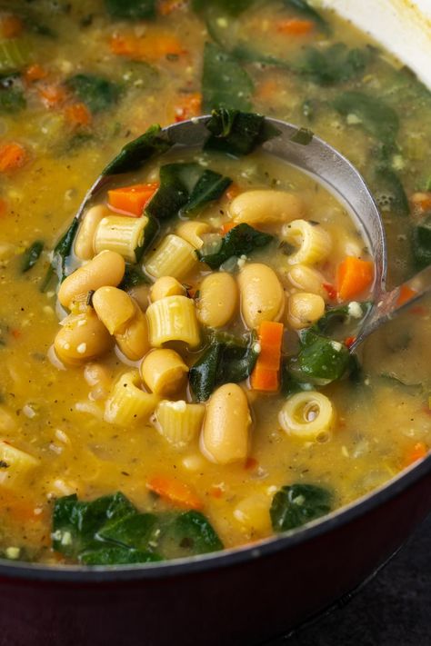 This white bean soup is full of rustic flavor, with creamy cannellini beans simmered in a creamy broth with veggies, rosemary, and pasta. White Bean And Pasta Soup, Creamy Cannellini Bean Soup, Meals With Cannellini Beans, White Bean Pasta Soup, Spinach And Cannellini Bean Soup, Vegetable Soup With Cannellini Beans, Cannellini Beans Soup, Bean Pasta Recipes, Pasta Soup Recipes