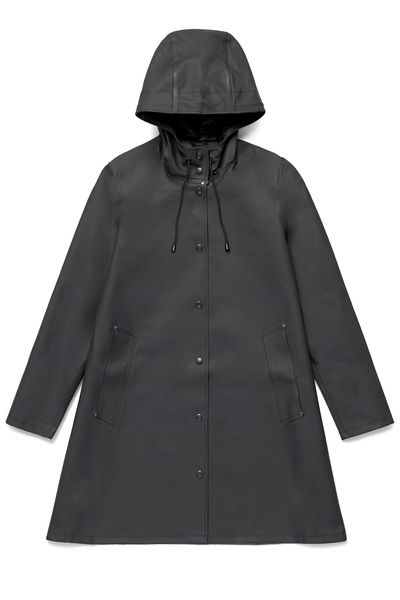 The Stutterheim Mosebacke raincoat is the women's version of our iconic Stockholm raincoat. This feminine style has a beautiful, A-line cut, creating a flattering silhouette. It is handmade in rubberized cotton, comes unlined, with double welded seams, snap closures and cotton drawstrings. The finest craftsmanship is used to create this style. Our raincoats have undergone severe testing in horrible conditions both at sea and in the city. Each coat is individually quality-controlled by our skille Mosebacke Raincoat, Stutterheim Mosebacke, Stutterheim Raincoat, White Rain Boots, White Knitwear, Black Raincoat, Green Raincoat, Rubber Raincoats, Raincoats For Women