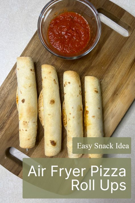 Satisfy your pizza cravings with the delicious Air Fryer Pizza Roll Ups! This Pinterest-famous appetizer features tortillas, mozzarella cheese, and pepperoni, all rolled up for a snack that's as fun as it is tasty. Discover the magic of this easy air fryer recipe, and be sure to save it for your next snack time adventure! Easy Lunch Ideas With Pepperoni, Easy Air Fryer Pizza Roll Ups, Pepperoni And Mozzarella Roll Ups, Air Fried Pizza Rolls, Crescent Roll Pizza Rolls Air Fryer, Dehydrate Air Fryer Recipes, Airfryer Pizza Rolls, Tortilla Pizza Rolls, Air Fryer Pizza Roll Ups