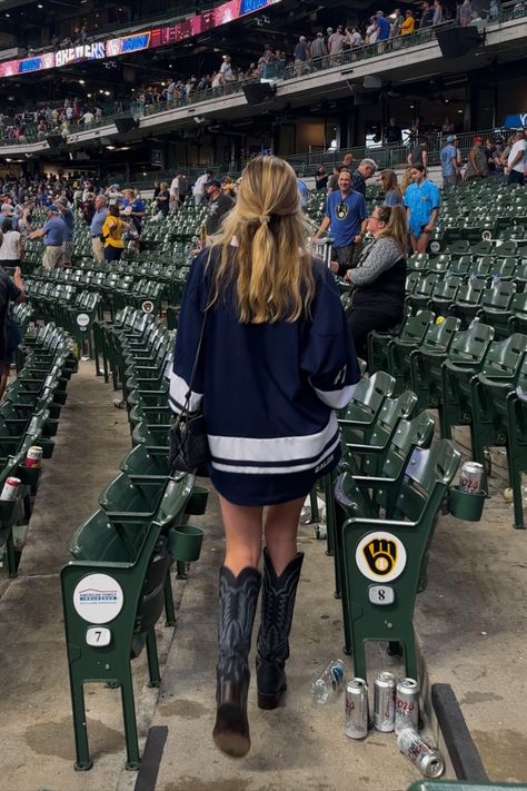 Payton Sartain wears a custom Brewers hockey-style jersey to a baseball game. What to wear to a baseball game. How To Style Hockey Jerseys Women, What To Wear To A Hockey Game, Cute Hockey Game Outfit, Hockey Game Outfits For Women, Hockey Jersey Outfit, Game Day Fits, Payton Sartain, Hockey Game Outfit, Baseball Game Outfit