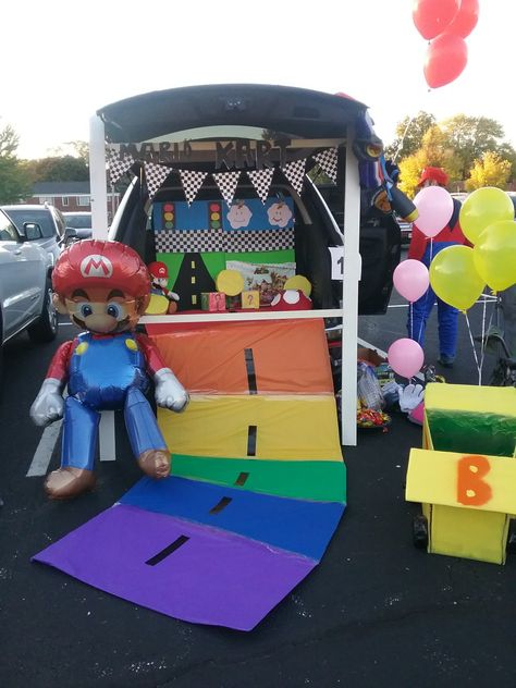 Mario kart trunk or treat Super Mario Cart Trunk Or Treat, Mario World Trunk Or Treat, Mario Kart Trunk Or Treat Ideas For Cars, Mario Halloween Trunk Or Treat, Mario Kart Rainbow Road Trunk Or Treat, Mario Party Trunk Or Treat, Trunk Or Treat Mario Kart, Mario Theme Trunk Or Treat, Mario Kart Halloween Decorations