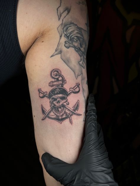 Tattoo of a pirate skull in front of an anchor and swords. Skeleton Pirate Tattoo, Pirate Skull Tattoos, Pirate Tattoo, Pirate Flag, Anchor Tattoo, Routine Tips, Beauty Routine Tips, Pirate Skull, Skull Tattoos