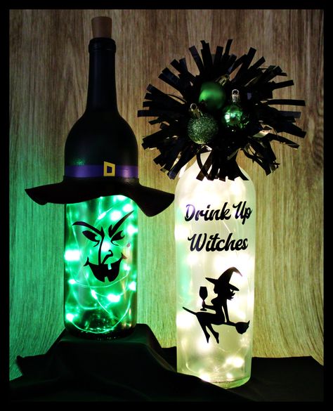 "Green Witch-Halloween-Lighted Wine Bottle-Gift-Home Décor DECOR This bottle is a perfect addition for your Halloween décor! It would also make an awesome gift for family or friends or a fun Halloween party centerpiece! It is a green, glass wine bottle, painted a light frost on the bottom half and matte black on the top half with black, old gold, and purple vinyl, green lights, and a black faux leather hat brim. Please message me if you are interested in different vinyl colors. Halloween bottle Witch Wine Bottle, Halloween Painted Wine Bottles, Wine Bottle Art Diy Home Decor, Witch Bottles Diy, Halloween Bottles Diy, Halloween Wine Bottles Diy, Halloween Wine Bottle Crafts, Sublimation Bottle, Halloween Party Centerpieces