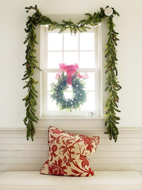 keeping holiday decor simple is as easy as a swaged garland + wreath suspended with ribbon in front of a window Wreaths For Windows Inside, Diy Christmas Garland Ideas, Christmas Garland Ideas, Christmas Wreaths For Windows, Window Garland, Garland Ideas, Diy Christmas Garland, Holiday Garlands, Festival Diy