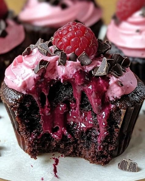 Raspberry Chocolate Lava Cupcakes 🍫🍇 Ingredients: For the Cupcakes: - 1/2 cup unsalted butter - 6 oz semi-sweet chocolate, chopped - 1/4 cup granulated sugar - 2 large eggs - 1/4 cup all-purpose flour - 1 tsp vanilla extract - 1/4 cup raspberry preserves For the Filling: - 6 fresh raspberries - 2 oz dark chocolate, chopped For the Topping: - Powdered sugar (for dusting) - Fresh raspberries Instructions: 1. Preheat the oven to 425°F and grease a muffin tin or line with cupcake liners. 2.... Raspberry Chocolate Lava Cupcakes, Dark Desserts, Chocolate Lava Cupcakes, Lava Cupcakes, Raspberry Chocolate Cake, Berry Cupcakes, Dark Chocolate Cupcakes, Raspberry Cupcakes, Chocolate Raspberry Cake