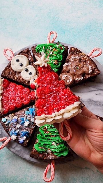 Sasha Nary / Aleksandra Naryzhny on Instagram: "New Christmas Brownie Pops!🍫☃️🎄 Decadent chocolate goodness with perfectly crinkly tops - these brownie slices are dressed in a variety of holiday classics to celebrate the holiday season! They were so much fun to put together for @Twisted, and are inspired by fall version of last year's! Instead of loved melted chocolate, I used my carton egg white swiss meringue buttercream, so good!😋 (recipe is in my cookbook) Brownie Slices Recipe Ingredients: 2/3 cup (130 g) granulated sugar 2/3 cup (135 g) dark brown sugar 3 eggs, room temperature 1/2 cup (113 g) unsalted butter 1 cup (100 g) dark chocolate chips/chunks 1/4 cup (54 g) vegetable oil 2 tsp vanilla 1/2 cup (75 g) all-purpose flour 1/2 cup (50 g) unsweetened cocoa powder 1 tbsp cornstar Unsweetened Cocoa Powder, Christmas Brownie, Meringue Buttercream, Christmas Tree Brownies, Swiss Meringue Buttercream, Brownie Pops, Swiss Meringue, Christmas Brownies, Dark Brown Sugar