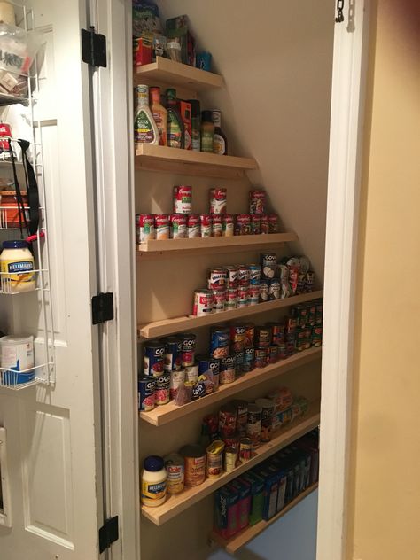 Finally made my "storage pantry" heading down basement stairs. May 2016 Basement Stairs Pantry Ideas, Pantry Room Under Stairs, Basement Stair Pantry, Basement Stairwell Storage, Under Stairway Pantry, Basement Stair Storage, Basement Pantry Storage, Pantry Under Stairs Walk In, Stairway Pantry