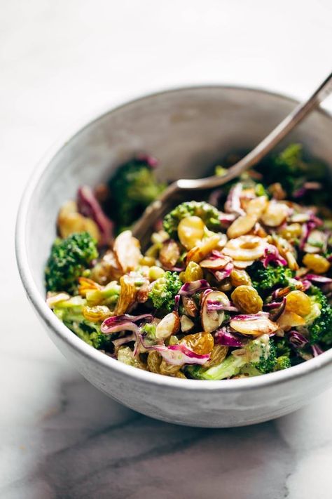 CLEAN Broccoli Salad - non-mayo-based vegan goodness! with purple cabbage, raisins, almonds, green onions, and almond butter dressing. #glutenfree #vegan #vegetarian #healthy #sugarfree #cleaneating #salad | pinchofyum.com Raw Broccoli Salad Recipes, Almond Butter Dressing, Clean Lunch, Butter Dressing, Healthy Broccoli Salad, Healthy Foods To Make, Clean Eating Recipes Lunch, Clean Eating Lunch, Cheap Healthy Meals