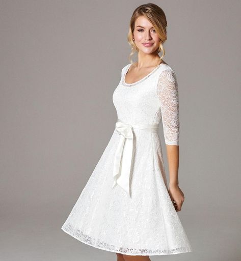 £179. A subtle scoop neckline and full skirt give this Alie Street wedding dress a lovely 1950s feel. Cut just above the knee in premium corded Ivory lace with subtle stretch for comfort and the perfect fit. #bridalparty #bridetobe #weddingregistry #dreamwedding #shesaidyes #aliestreet #london #madeinbritain #ukfashion #style #ootd #fashion #streetstyleluxe #streetstyle #londonstreetstyle #lookbook #fashiontrends #whatstrending #ontrend #styleblog #fashionmagazine #outfitinspiration #lifestyle Short Ivory Wedding Dress, Wedding Dresses For Older Women, Simple Wedding Dress Short, Confirmation Dresses, Wedding Dress Short, Street Wedding, Wedding Dress Crafts, Knee Length Wedding Dress, Dresses Occasion