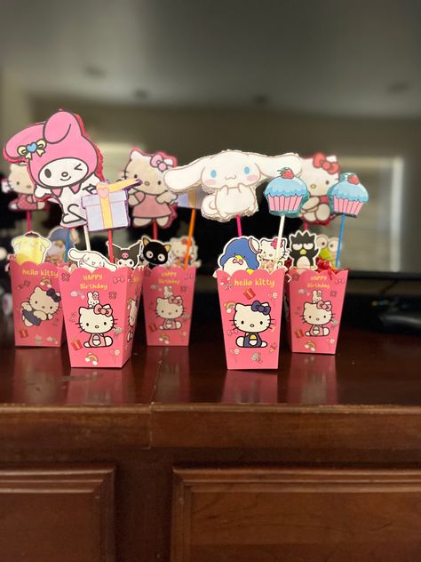 Hello kitty theme birthday party Sanrio Party Centerpieces, Sanrio Table Decor, Sanrio Centerpiece Ideas, Sanrio Birthday Theme, Sanrio Birthday Party Decorations, Hello Kitty And Friends Party, Hello Kitty Theme Birthday Party, Hello Kitty Theme Birthday, Sanrio Bday