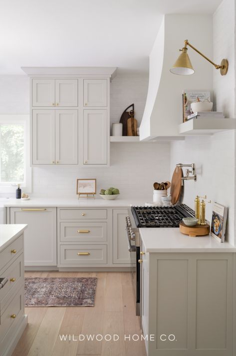 Create a functional yet beautiful kitchen with this white remodel. Featuring a kitchen island with seating and extensive wrap-around cabinets, this space is designed for storage and style. The soft white color palette enhances natural light, while clean lines and warm woods create a cozy atmosphere. Modern lighting and hardware add elegance to complete the look. Learn how the kitchen layout was adjusted for better flow and function, making it perfect for everyday use and family gatherings.