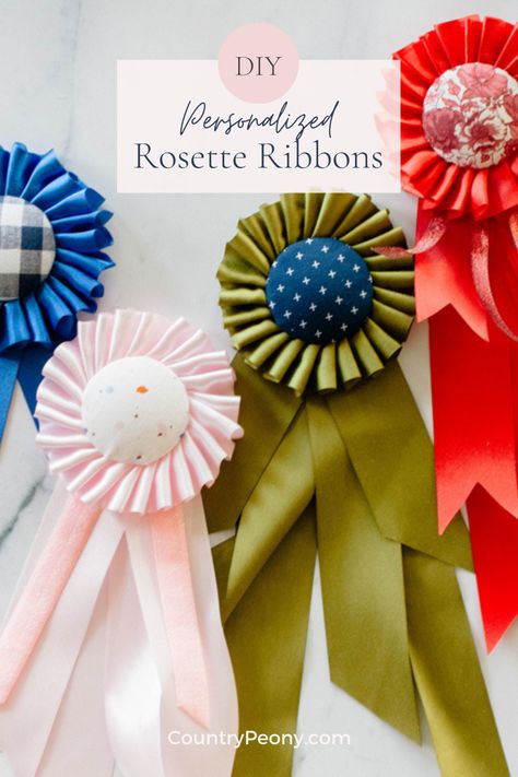 Add a little vintage and personalized charm into your life with these custom rosette ribbons. Today I partnered with Clover to bring you the step-by-step tutorial to make your own rosette ribbons. These make the perfect gift, or are the perfect vintage inspired addition to your home decor. #diyrosetteribbons #rosetteribbons #rosette #diyrosette #homemadegift #diygift Rosette Ribbon Diy, Diy Ribbon Rosette, How To Make A Ribbon Rosette, Ribbon Rosettes Diy, Award Ribbons Diy, How To Make Rosettes, Diy Rosette, Blue Ribbon Award, Rosette Ribbon