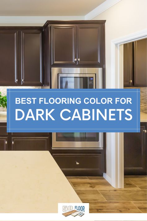 Dark cabinets bring a rich, elegant look to your kitchen, and pairing them with the right flooring can really enhance the space. Avoid selecting a dark floor if you have dark cabinets; this can create the illusion of an enclosed space and make your kitchen feel smaller. A paler floor color can create a wider, more open space and make your kitchen look lighter! #flooringideas #kitchendesign Dark Cabinets Oak Floors, Dark Cabinets With Wood Floors, Floors With Dark Cabinets Kitchen, Floors For Dark Cabinets Kitchen, Wood Floor With Dark Cabinets, What Color Floor With Dark Cabinets, Light Floors And Dark Cabinets, Wood Flooring With Dark Cabinets, Dark Floor With Dark Cabinets