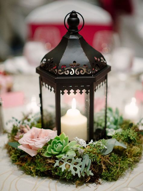 Light the way to your romantic reception with lanterns. Surround them with succulents and moss for a woodland touch with lots of character for your wedding centerpieces. Cheap Wedding Table Centerpieces, Succulent Wedding Centerpieces, Romantic Wedding Centerpieces, Beautiful Wedding Centerpiece, Lantern Centerpieces, Succulent Centerpieces, Unique Wedding Flowers, Wedding Floral Centerpieces, Wedding Lanterns