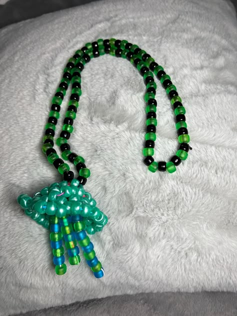 A green jellyfish kandi necklace! Great for raves, festivals, cosplay, etc. Made with durable cloth covered elastic and pony beads. Kandi Jellyfish, Green Jellyfish, Kandi Designs, Kandi Necklace, Kandi Inspo, Candy Ideas, Diy Kandi, Kandi Kid, Kandi Ideas