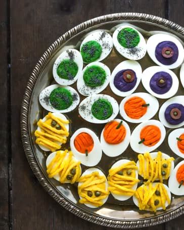 Halloween Deviled Eggs Recipe (Easy) | Kitchn Scary Halloween Treats, Halloween Deviled Eggs, Deviled Eggs Recipe Easy, Halloween Treats To Make, Cozy Recipes, Halloween Party Appetizers, Purple Food Coloring, Spooky Halloween Treats, Treats To Make