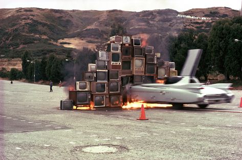 In Ant Farm's 1975 video art piece, "Media Burn," the group's members drive a Cadillac into a wall of burning televisions. "Space, Land, and Time: Underground Adventures with Ant Farm" will be featured Wednesday night at the Hammer Museum.  	Credits: HAMMER MUSEUM Farm Architecture, Straight Photography, Texas Lakes, Cadillac Ranch, Ant Farm, Lake Pontchartrain, Ant Farms, Dont Drink And Drive, Concrete Building