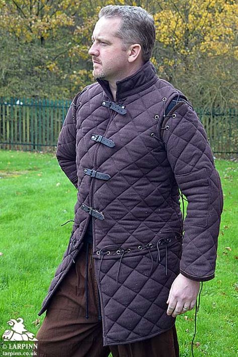 "Black Medieval Gambeson Thick padded Jacket COSTUMES DRESS SCA Product Details The standard Gambeson is constructed from heavy duty denim. Points at the shoulders are visible, points at the elbows aren't, but they are there. Similarly the elbow pads are internal. with different medieval time horn/bone/wood button, Fabric covered buttons The Gambeson is built of fine quality cotton fabric. When worn by itself it is comfortable to wear. Medium # Chest-41\" Length From Shoulder- 40\" Sleeve-22\" L Light Armour, Medieval Gambeson, Medieval Reenactment, Medieval Cosplay, Armor Dress, Armor Clothing, Concept Art Tutorial, Historical Armor, Armadura Medieval