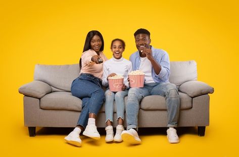 Photo joyful black family of three sitti... | Premium Photo #Freepik #photo #family-tv #happy-family #family-sofa #family Black Happy Family, People Watching Tv, Family Watching Tv, Happy Family Images, Branding Infographic, Eating Popcorn, Wallpaper Windows 10, Family Sofa, Pink Flowers Background